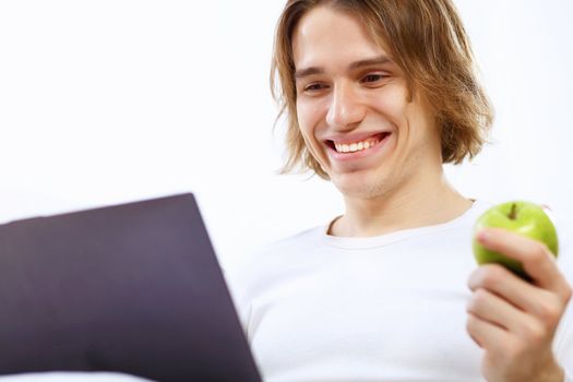 Portrait of a young man with notebook