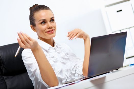 Young manager working with notebook in the office