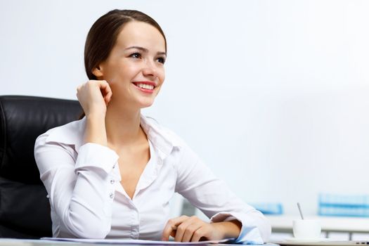 Portrait of young successful businesswoman in the office