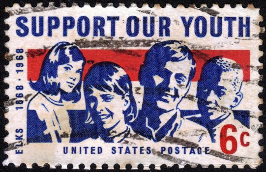 USA - CIRCA 1968: A stamp printed in USA shows a picture of young men and women, inscription Support Our Youth, dedicated to the 100th anniversary of the Youth program, circa 1968