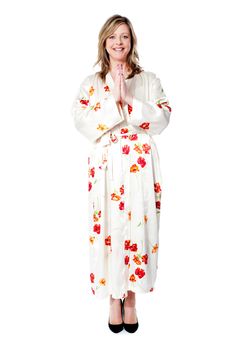 Full length shot of woman welcoming you. Dressed in fashionable attire