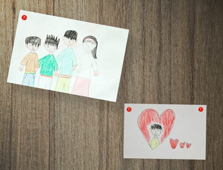 Drawing of family, paper on wood background