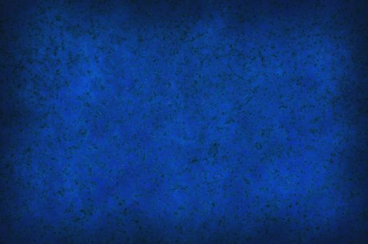 Grungy dark blue mottled background surface texture