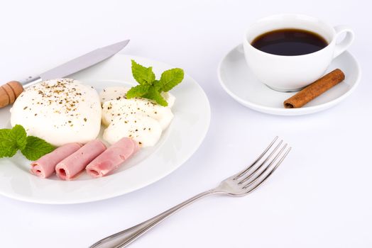 Mozzarella cheese and ham with a cup of coffee.