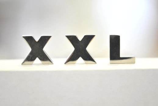 xxl sign, colored labels on the artistic shot