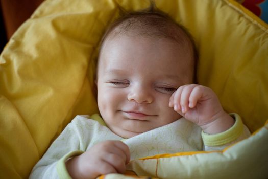 sweet sleeping smiling newborn baby