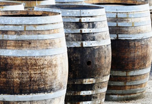 Beautiful photo of a wine cellar with barrels in stacks 