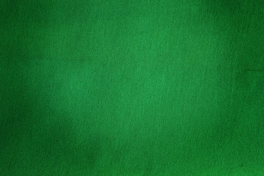 Green old grunged textile for the use of a background