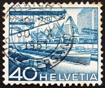 SWITZERLAND - CIRCA 1949: a stamp printed in the Switzerland shows Harbor of the Rhine, circa 1949
