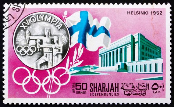 SHARJAH - CIRCA 1968: a stamp printed in the Sharjah UAE shows Olympic Games Helsinki 1952, Sweden, History of Olympic Games, circa 1968