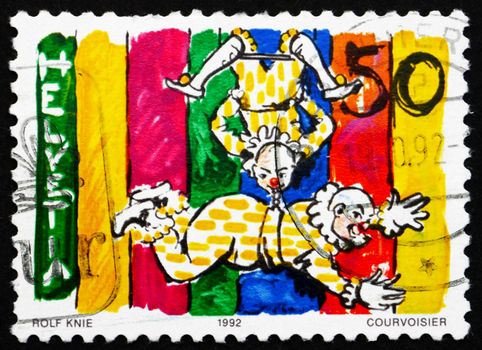 SWITZERLAND - CIRCA 1992: a stamp printed in the Switzerland shows Clowns on Trapeze, World of the Circus, circa 1992