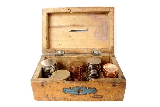 very old wooden moneybox filled with romanian currency