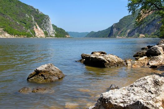scenic rocks in river on Danube riverbank in Serbia at summertime