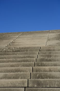 Asphalt Staircase towards blue sky