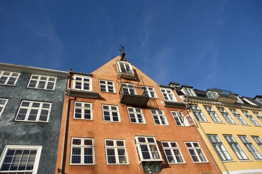 House in a row towards blue sky