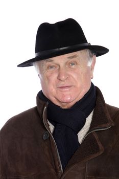 Fashionable male pensioner in a winter scarf jacket and hat, head and shoulders portrait isolated on white