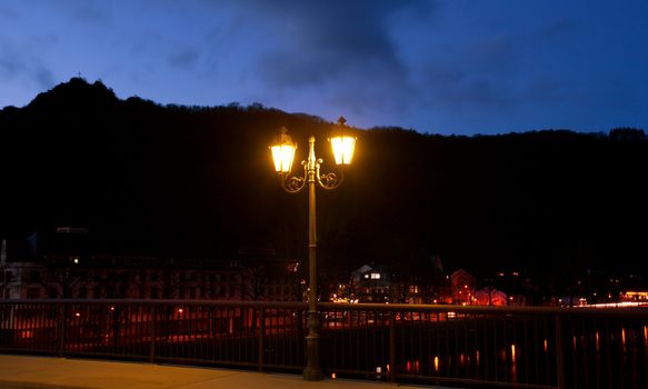 old style metal lantern on the night street