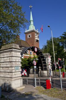 The entrance to rotherhithe tunnel and St. Olav's Norweigan church in London.