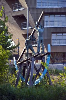 The Deal Porters statue at Canada Water in London. The deal porters were the labourers in the London's docks.