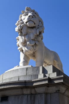 Lion statue made from Coade Stone - located on the Southern end of Westminster Bridge in London.