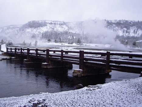 Snow storm over bridge in Yellowstone Park, USA
