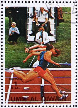 UMM AL-QUWAIN - CIRCA 1972: a stamp printed in the Umm al-Quwain shows Sprint, Olympic Sport, Olympic Games of the past, circa 1972