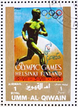 UMM AL-QUWAIN - CIRCA 1972: a stamp printed in the Umm al-Quwain shows Helsinki 1952, Finland, Olympic Games of the past, circa 1972