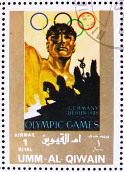 UMM AL-QUWAIN - CIRCA 1972: a stamp printed in the Umm al-Quwain shows Berlin 1936, Germany, Olympic Games of the past, circa 1972