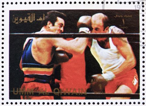UMM AL-QUWAIN - CIRCA 1972: a stamp printed in the Umm al-Quwain shows Boxing, Olympic Sport, Olympic Games of the past, circa 1972