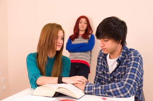 Students in classroom, jealous girl looking at a couple