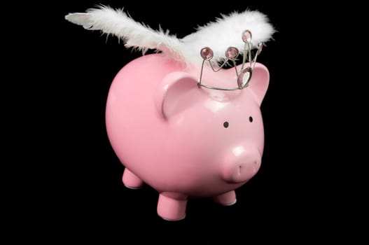 pInk piggy bank with wings on black background