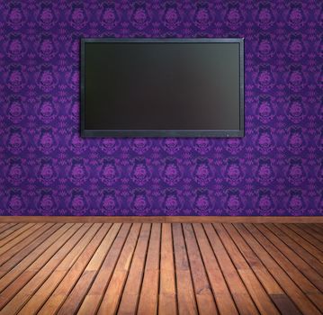 wide screen television in  purple wallpaper room