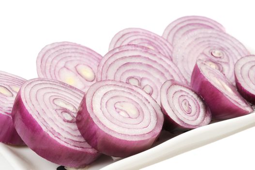 РЎhopped red onion circles. Isolated on white.