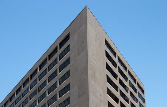 Downtown building at an angle on a sunny day.
