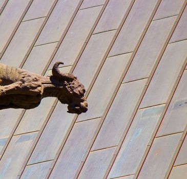 A gargoyle stands watch.