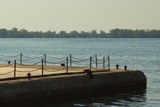 Quiet boardwalk on a lake.  Horizontal composition with copy space.