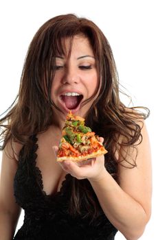 A woman eating a slice of delicious pizza.  