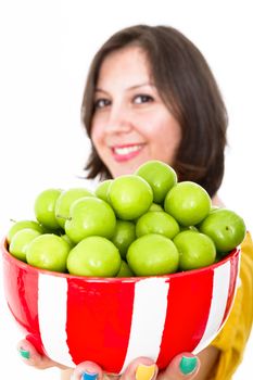 Greengages presented in a bowl with a warm smile.