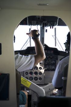 Pilots in the cockpit of a small seaplane