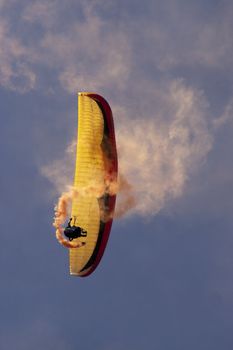 Paraglider with trail smoke