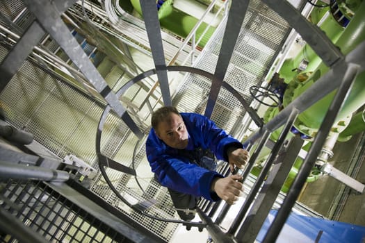 Engineer climbing ladder