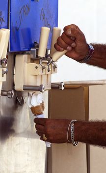 Man filling ice cream cone