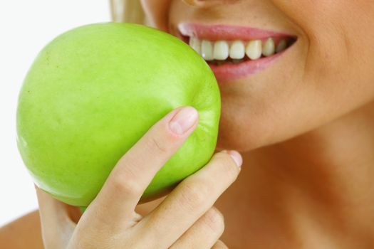 woman eat green apple on white