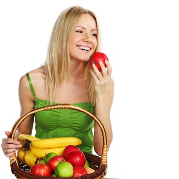 woman holds a basket of fruit