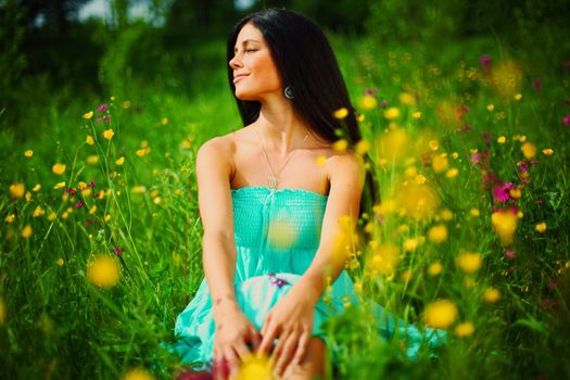 woman on summer flower field