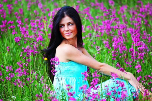 woman on summer flower field