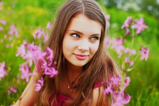 woman on summer flower field