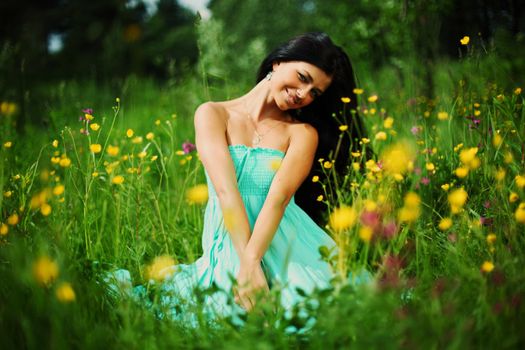 woman on summer flower field