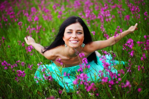 woman on summer flower field