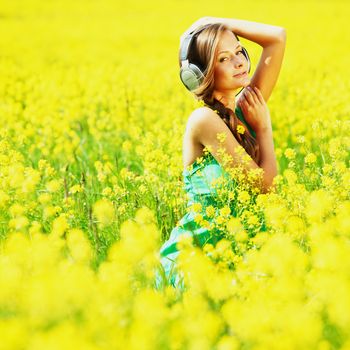 listening to music on oilseed field